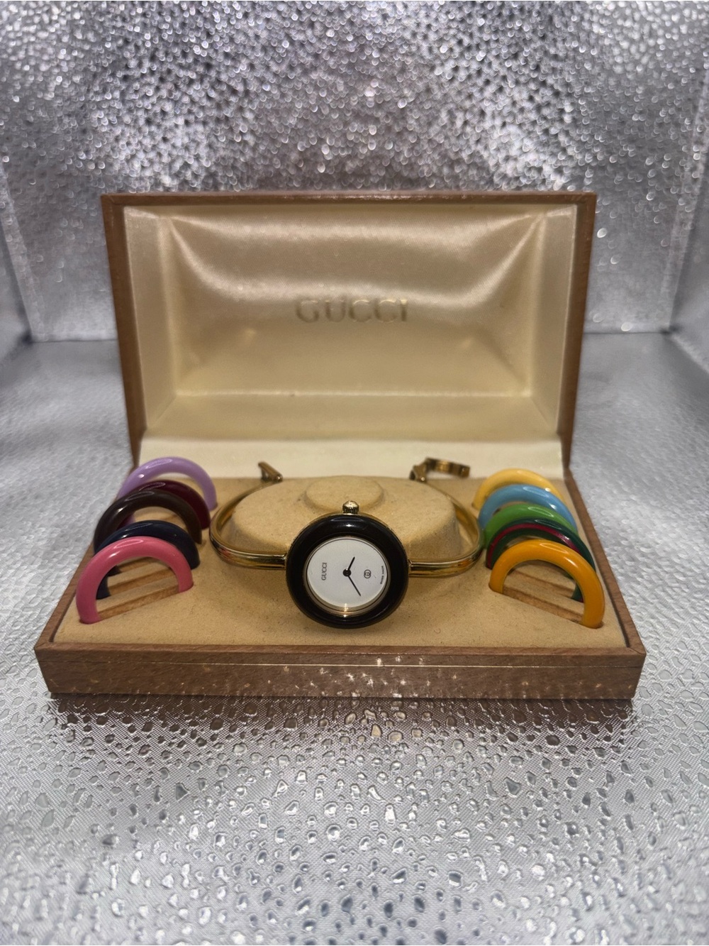 Gucci Gold-Tone Bangle Watch with Interchangeable Colorful Bezels